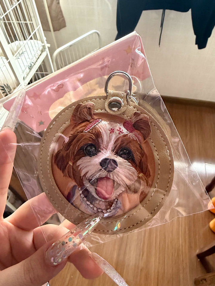 Brown Shih Tzu portrait keychain in clear packaging on pink background